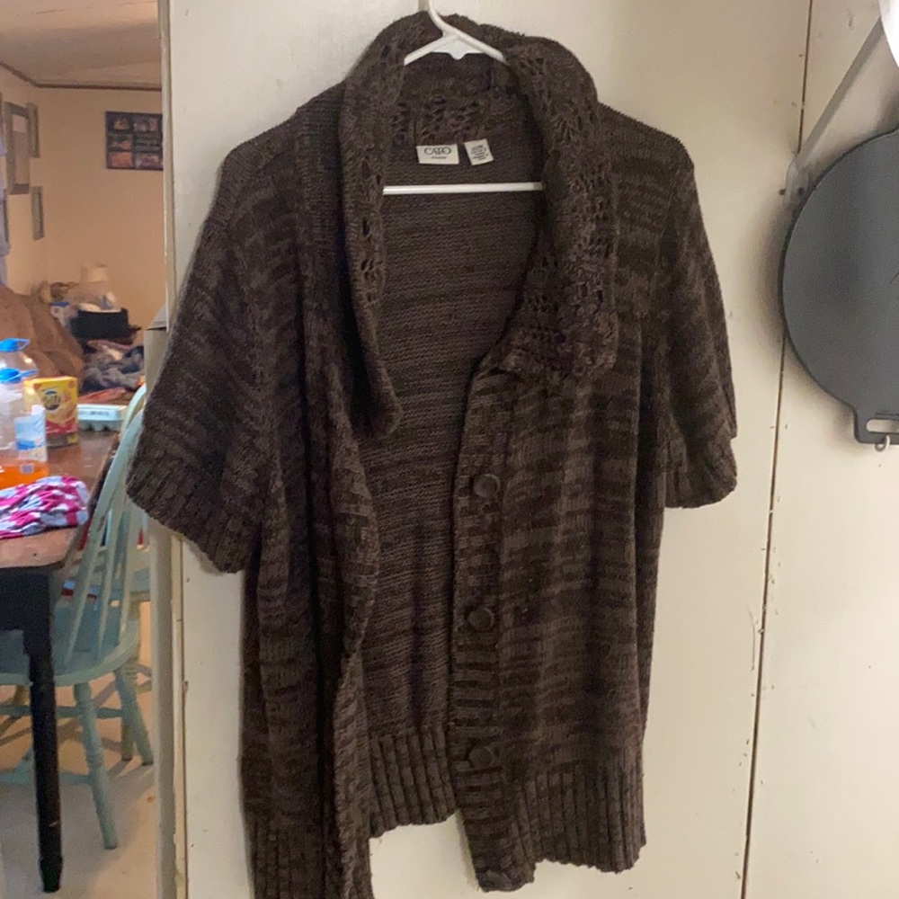 A sweater type over shirt short sleeve button up